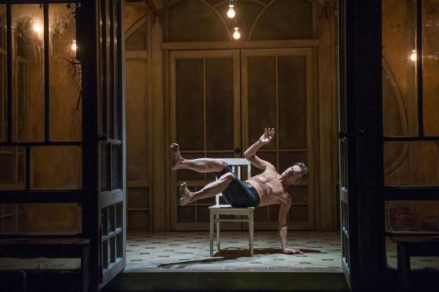 Baryshnikov in the greenhouse tilted on the chair